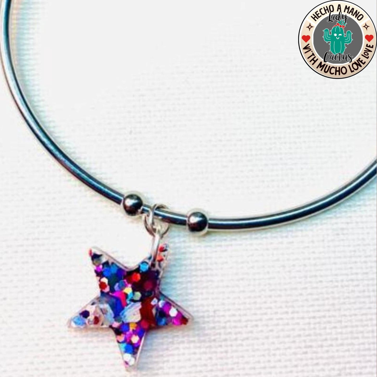 Pulsera ajustable de acero para mujer con diseño de estrella original