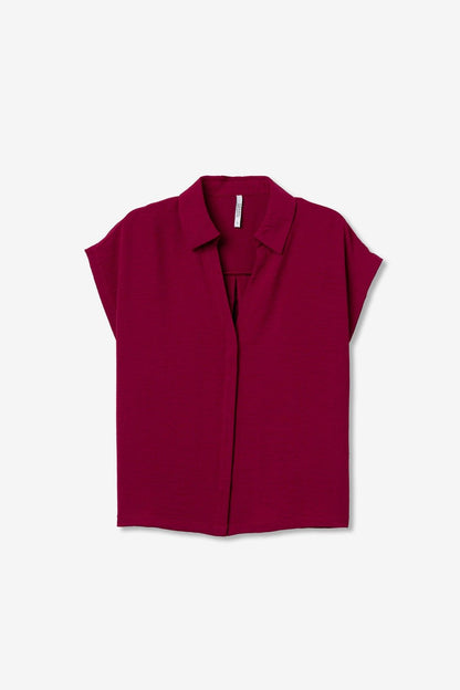 Camisa rosa básica elevada con corte relajado para mujer.