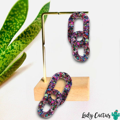 Pendientes artesanales de resina epoxi con purpurina y diseño ovalado