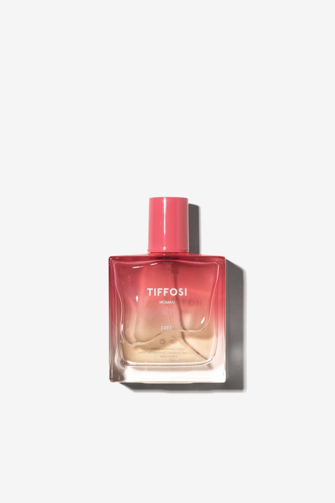 Frasco de perfume Free de Tiffosi de 50 ml con colores degradados rosa y beige.